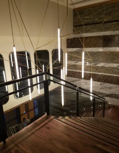 A stairway with wooden railings and a wooden staircase.