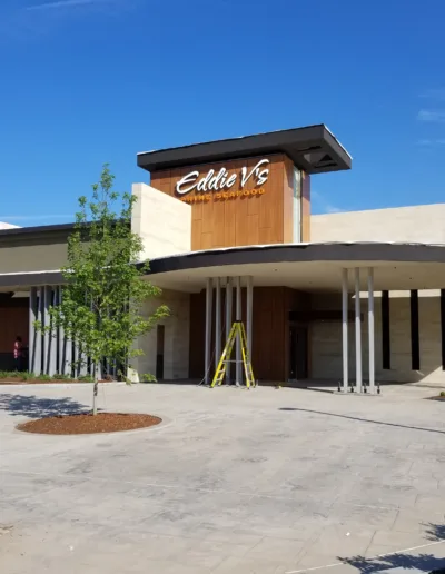 The exterior of a restaurant that is under construction.