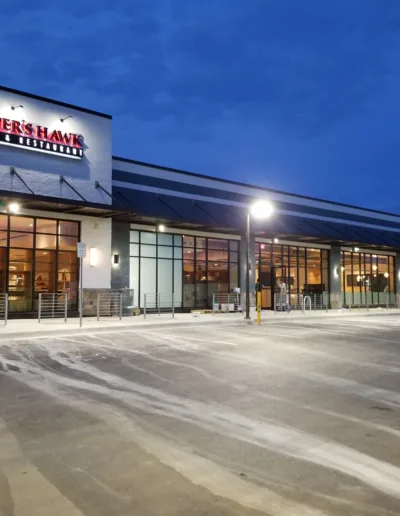 The exterior of a restaurant at night.