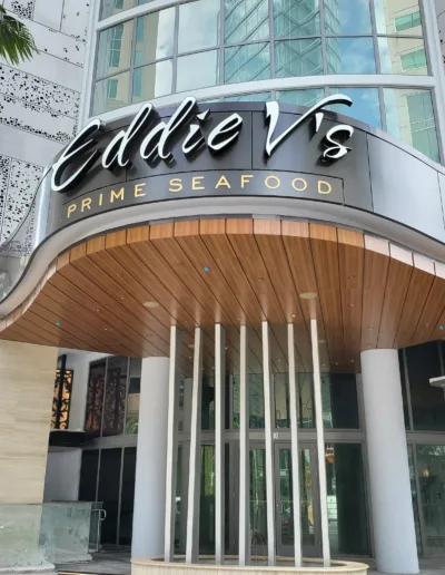 The entrance to a building with a sign that says adie vs seafood restaurant.