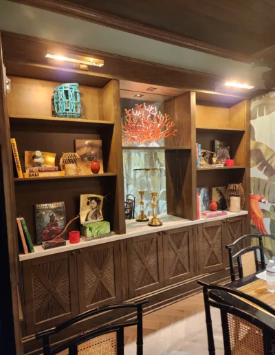 A dining room with a table and chairs.