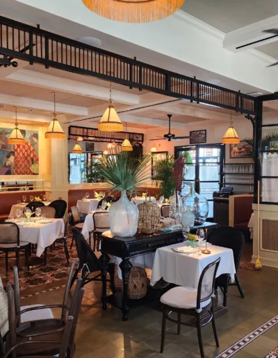 The interior of a restaurant with tables and chairs.