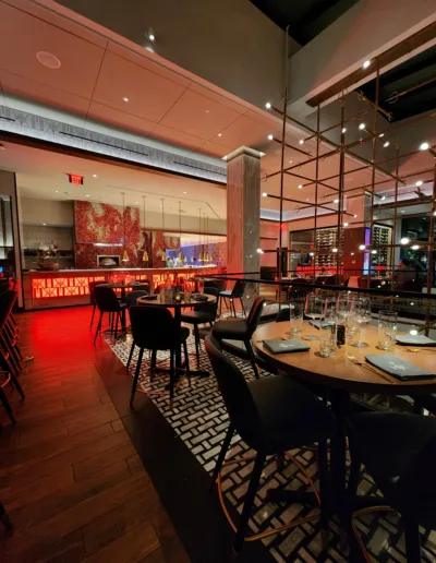 The interior of a restaurant with tables and chairs.