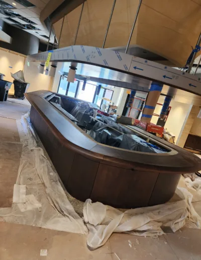 A restaurant is being renovated with a large counter top.