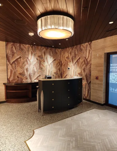 The lobby of a cruise ship with a wooden floor.